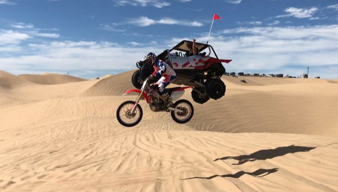 This UTV Driver Sails Past This Dirtbike Rider in Mid Air + Video